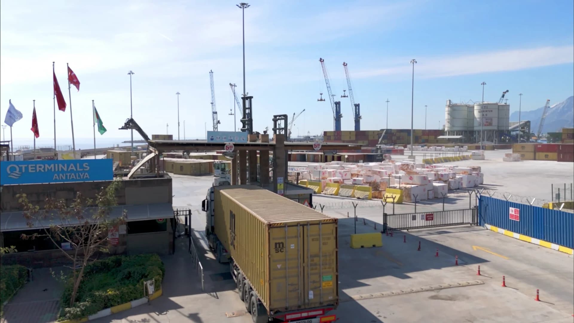 Container truck moving through the QTerminals Antalya gate environment